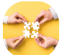 Hands connecting a puzzle