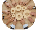 Hands together holding wooden gears